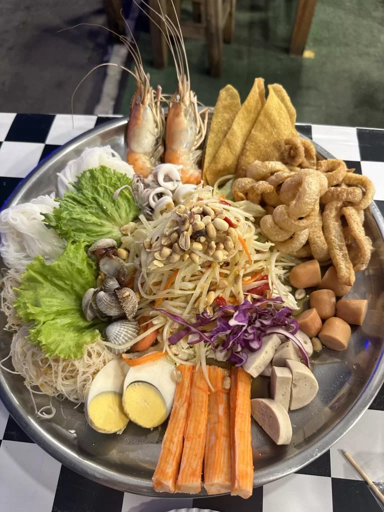 A salad bowl is traditional Thai food that can be found at night markets in Bangkok.